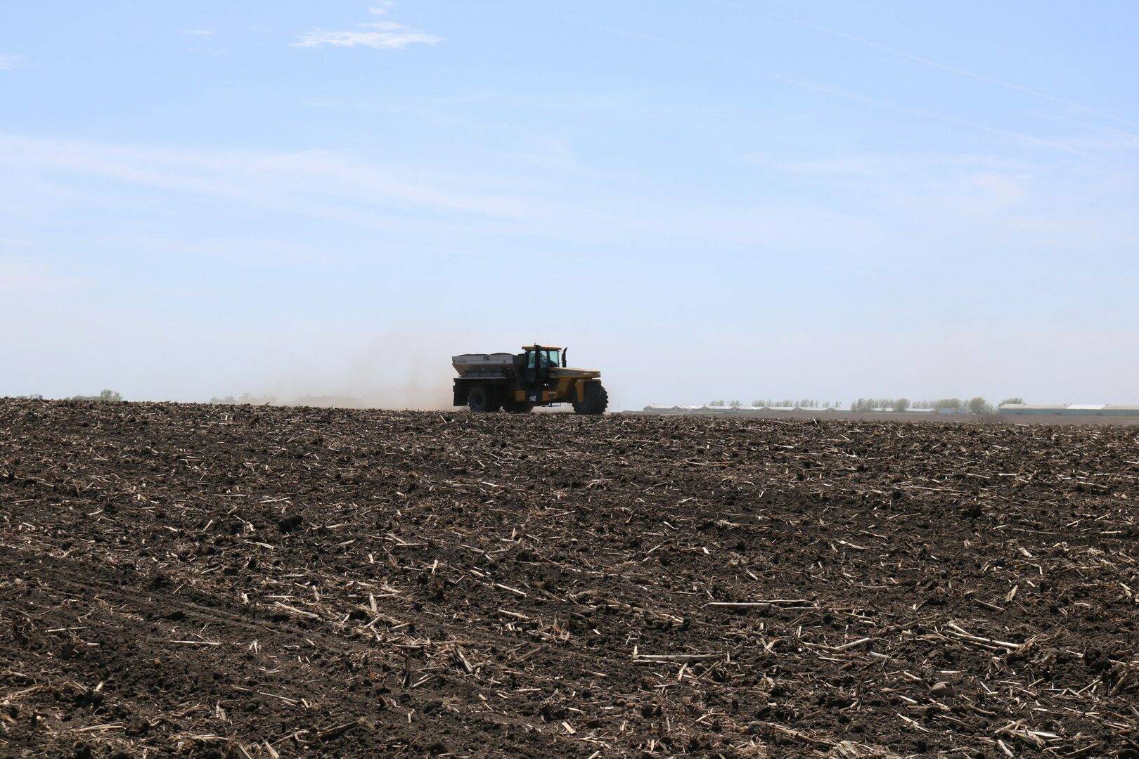 Applicator spreading SO4 in farm field